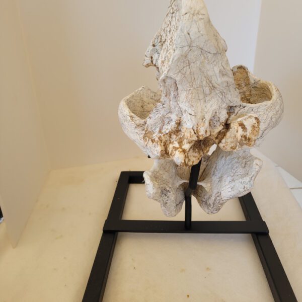 A sculpture of a person sitting on top of a table.