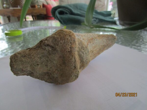 A piece of stone sitting on top of a table.