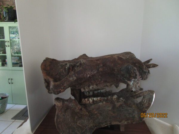 A pair of fake animal heads sitting on top of each other.