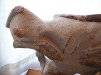 A close up of the side of an animal sculpture