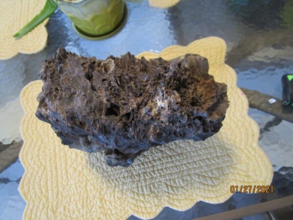 A piece of rock on top of a paper plate.