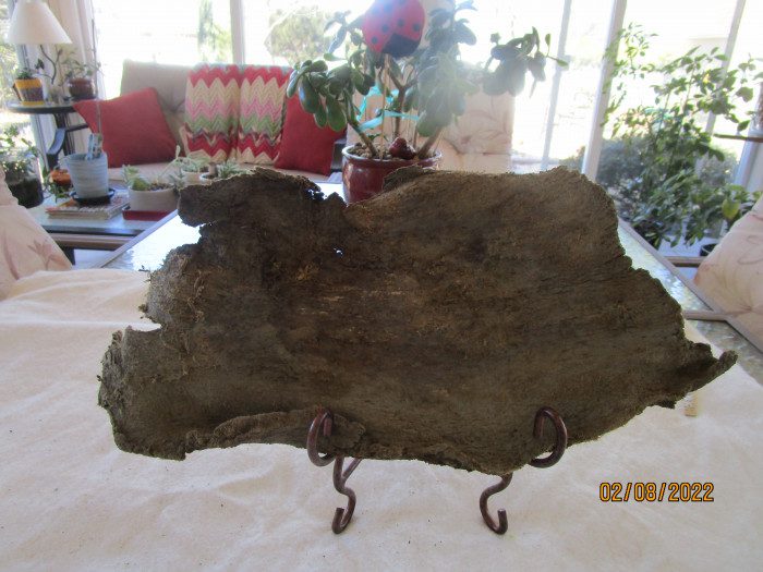 A piece of wood sitting on top of a table.